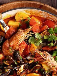 Cataplana con mejillones y gambas al horno